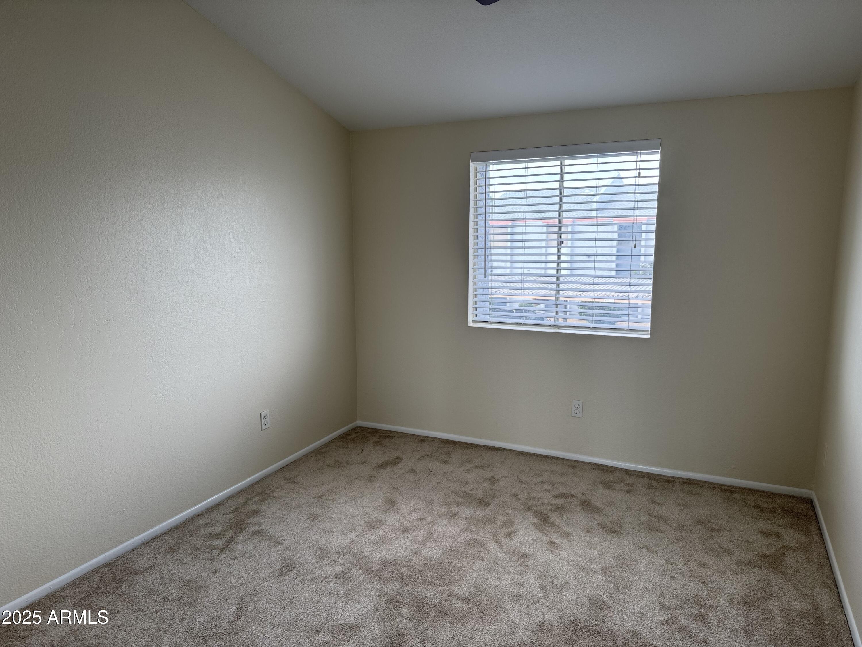 7550 North 12th Street, Unit 239 Phoenix, AZ 85020 - Photo 11 of 14 an empty room with a window