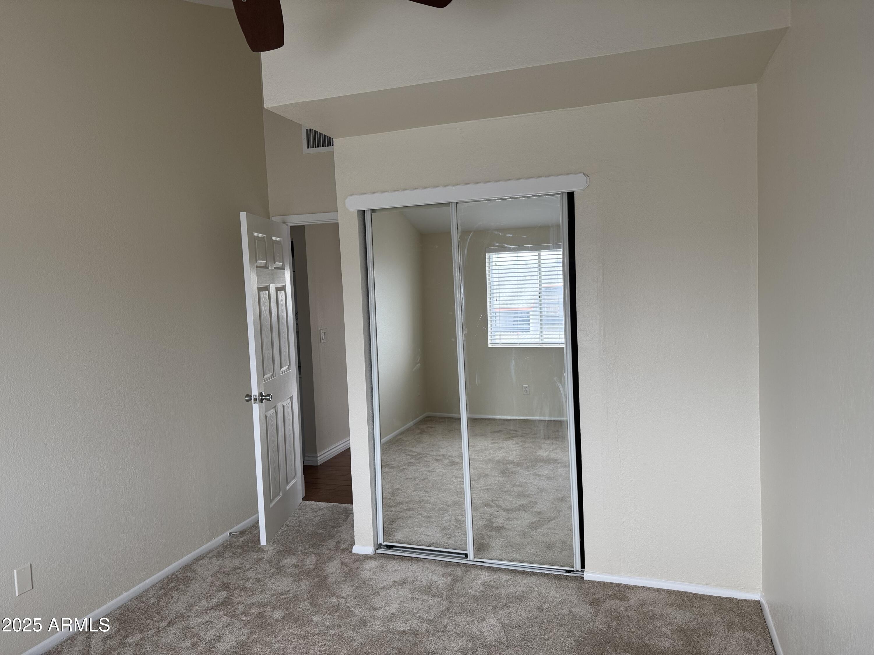 7550 North 12th Street, Unit 239 Phoenix, AZ 85020 - Photo 12 of 14 an empty room with windows