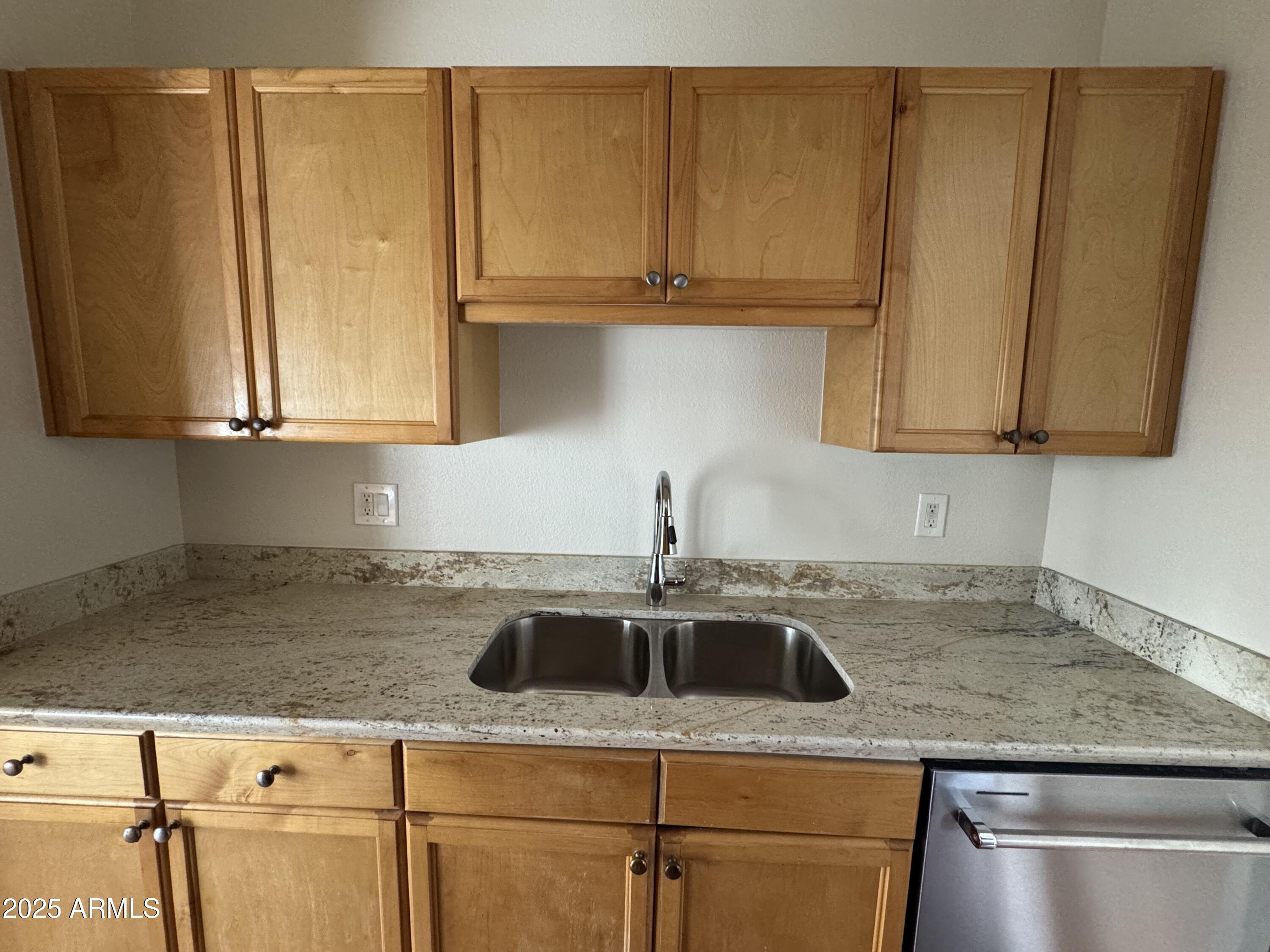7550 North 12th Street, Unit 239 Phoenix, AZ 85020 - Photo 3 of 14 a kitchen with a sink and cabinets
