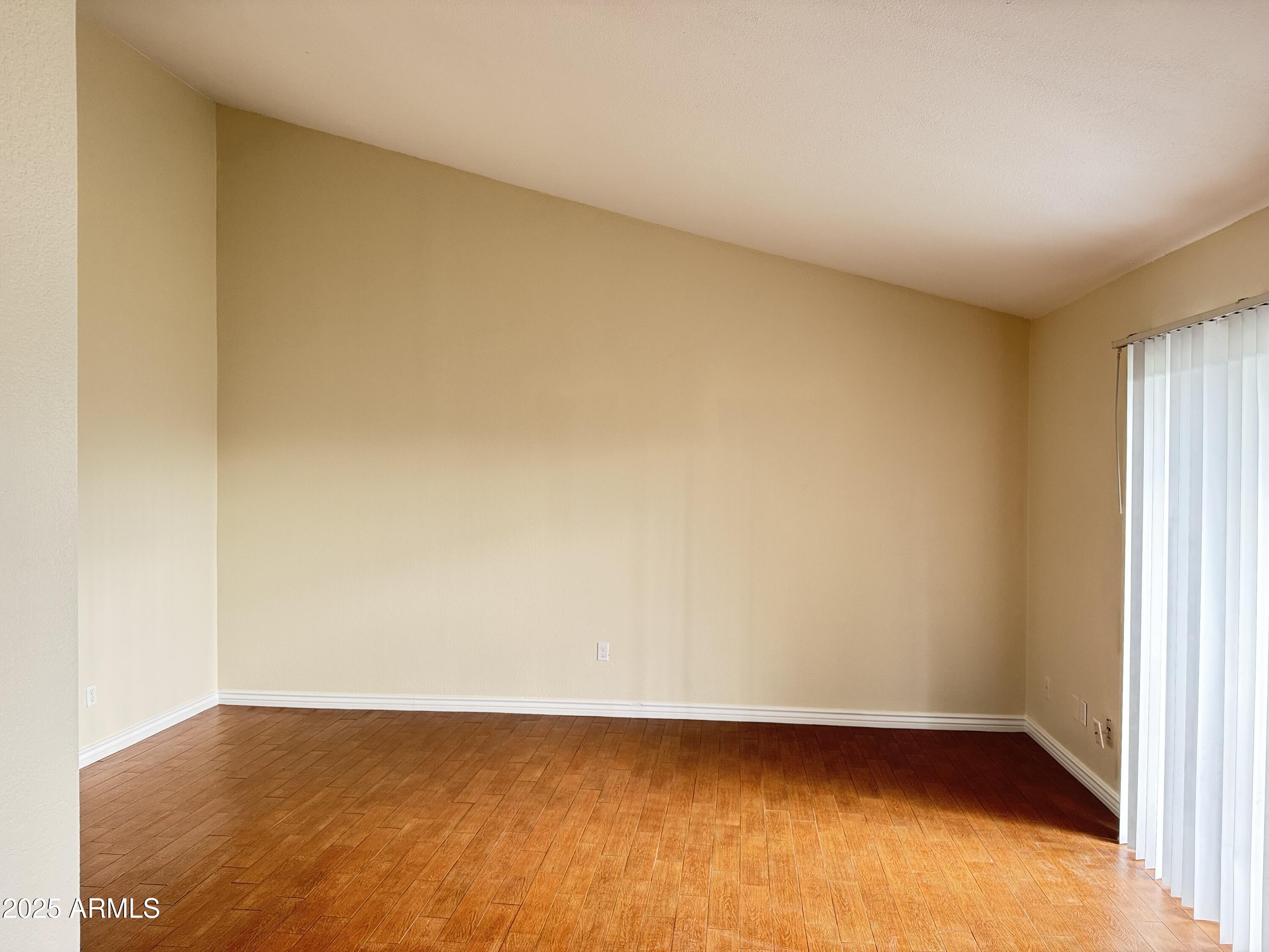 7550 North 12th Street, Unit 239 Phoenix, AZ 85020 - Photo 6 of 14 a view of an empty room and window