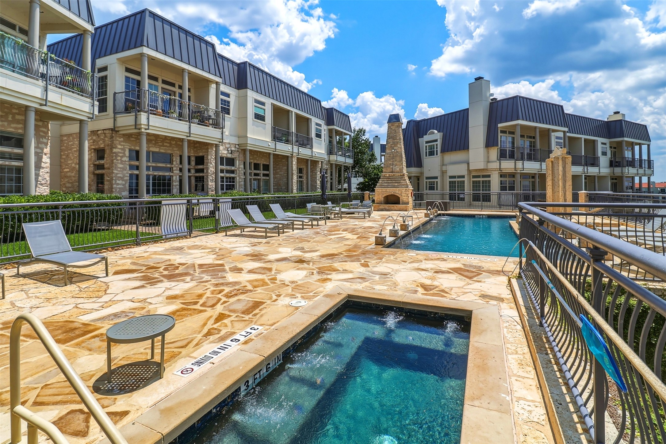 2918 Ranch Road 620, Unit 265 Austin, TX 78734 - Photo 27 of 40 Spa, steps away from the unit and a charming outdoor fireplace for you to enjoy every day.