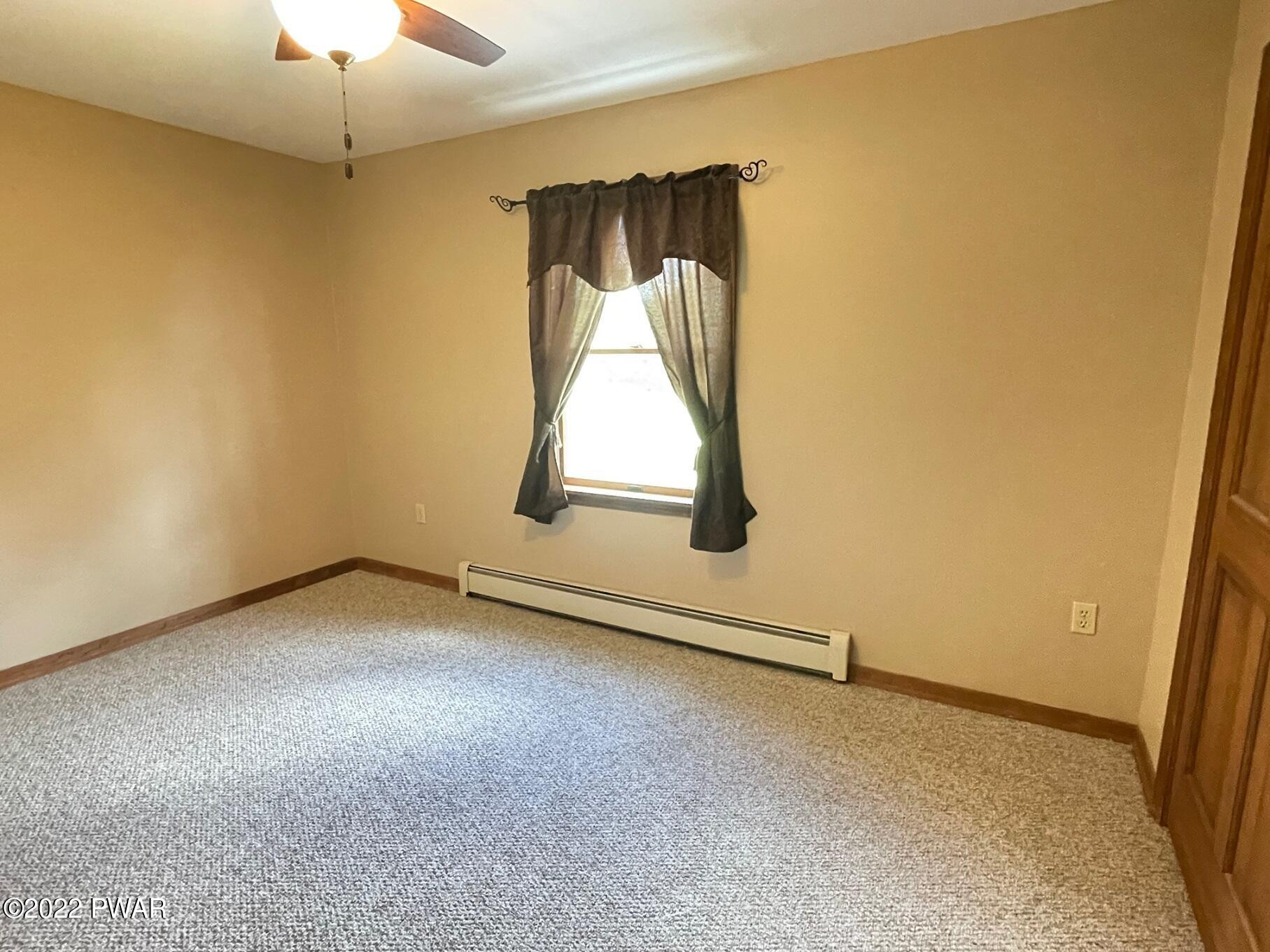 524 Creamton Drive Prompton, PA 18456 - Photo 42 of 57 an empty room with a fireplace