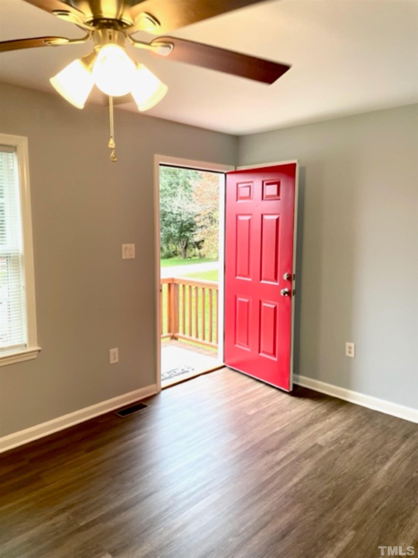 1323 Pointer Street Roxboro, NC 27573 - Photo 15 of 51 a view of a livingroom with wooden floor and a window