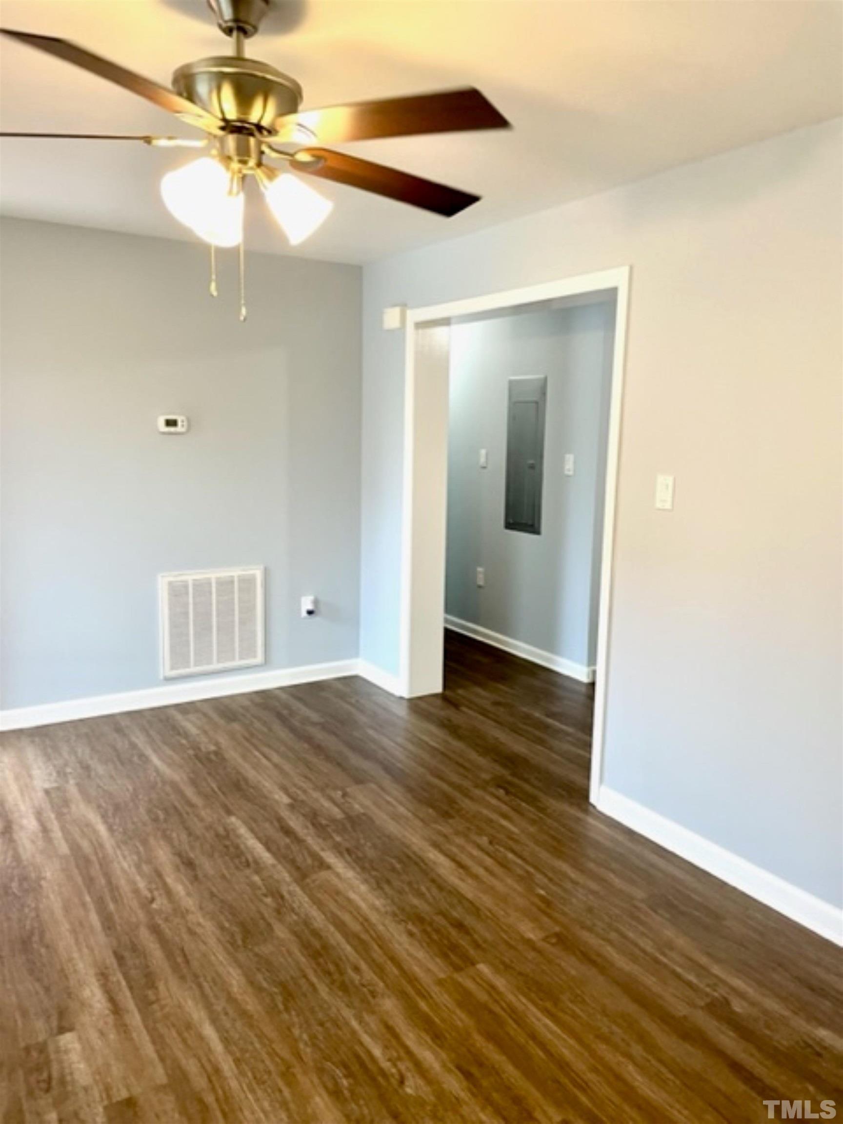 1323 Pointer Street Roxboro, NC 27573 - Photo 17 of 51 a view of an empty room with wooden floor