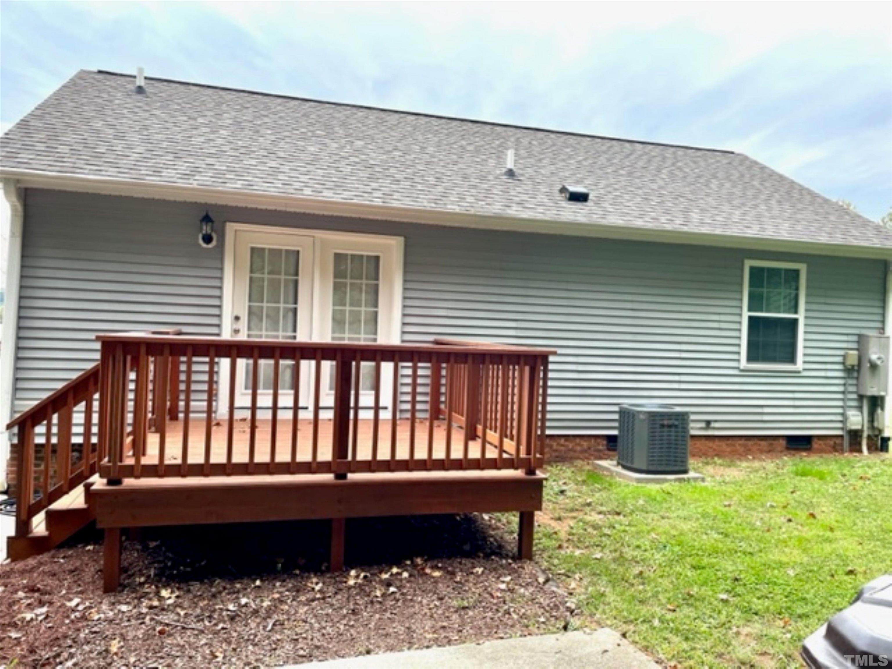 1323 Pointer Street Roxboro, NC 27573 - Photo 3 of 51 a view of a house with a wooden deck and a yard