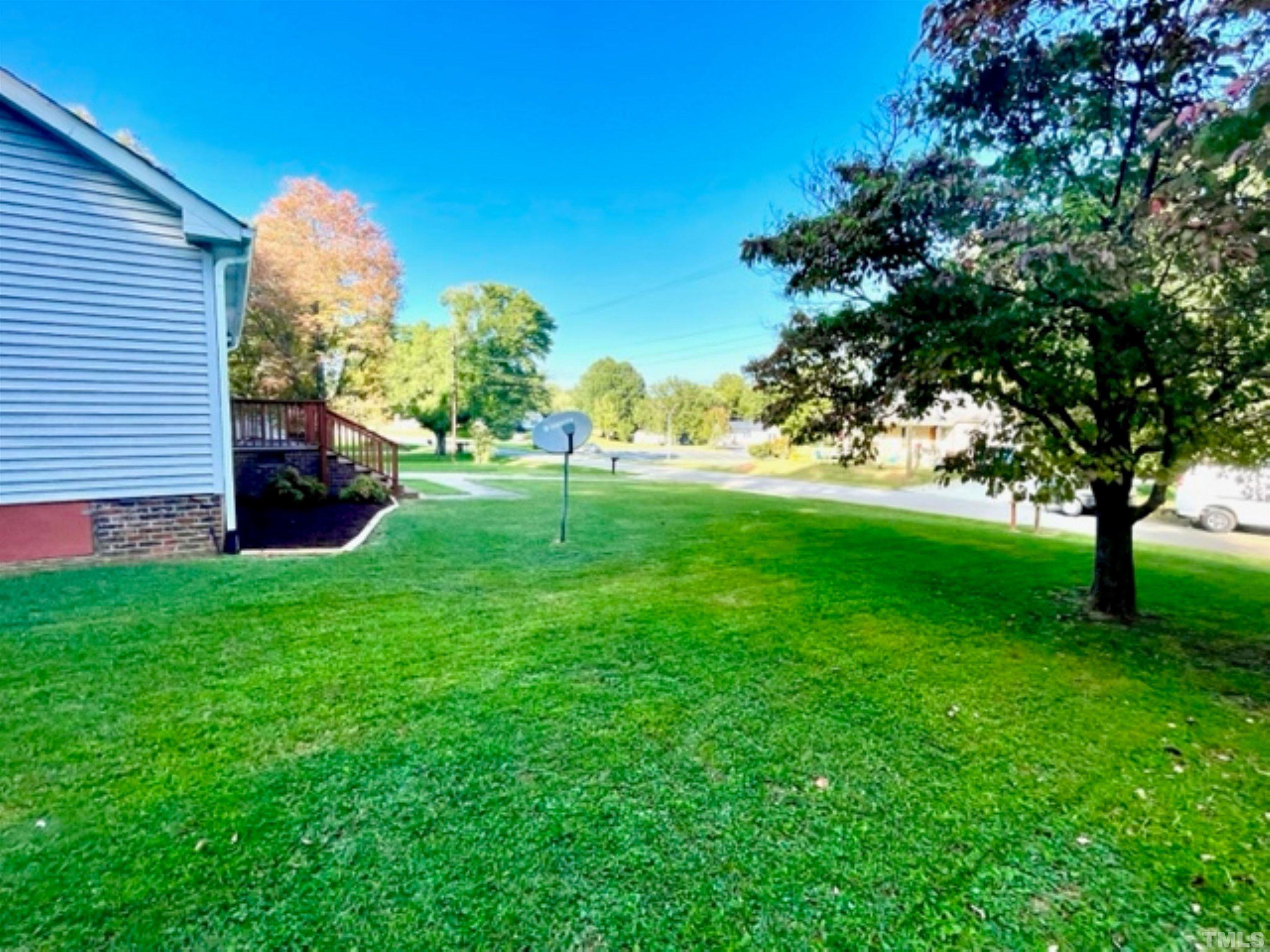 1323 Pointer Street Roxboro, NC 27573 - Photo 31 of 51 a backyard of a house with lots of green space