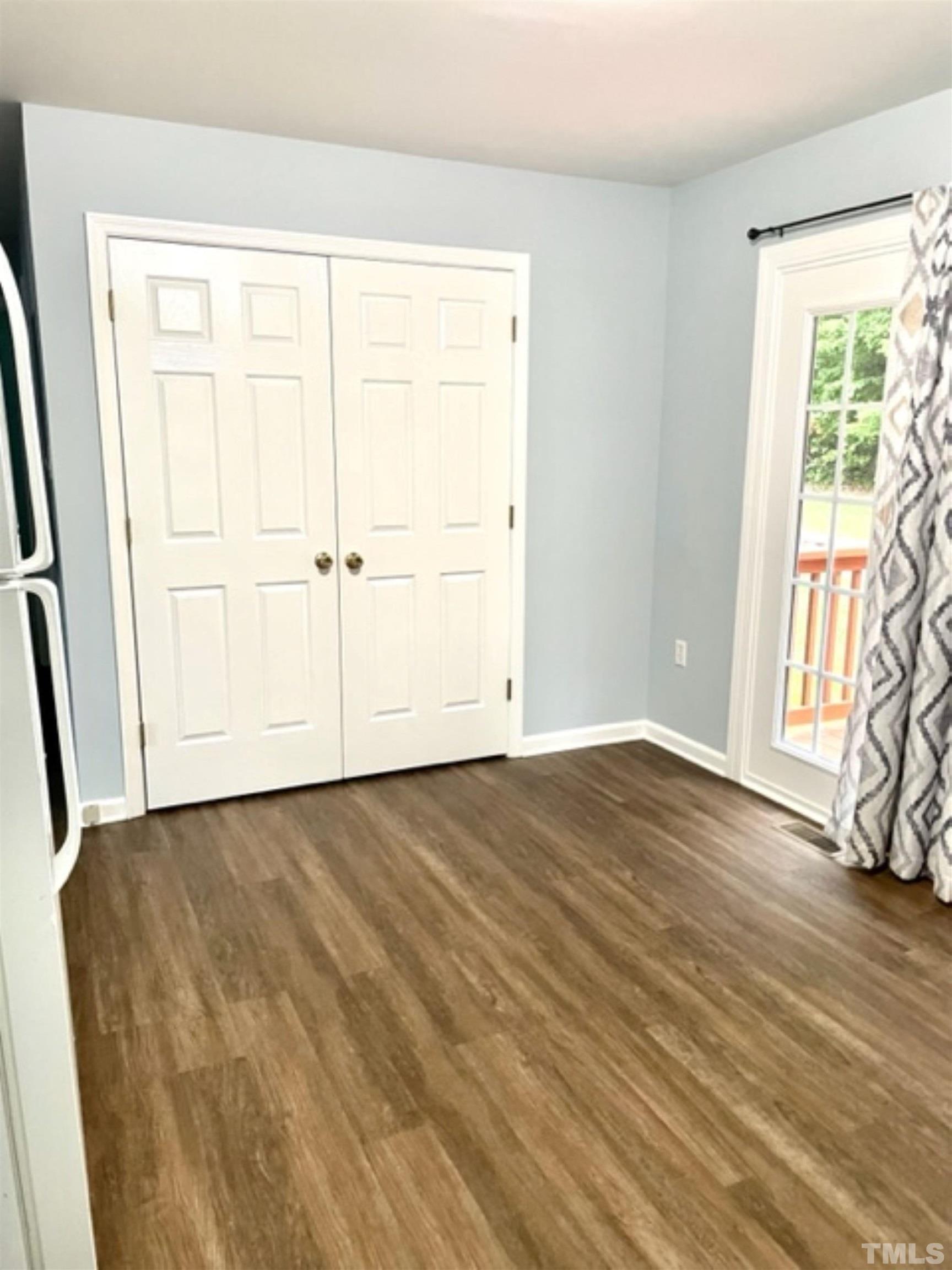 1323 Pointer Street Roxboro, NC 27573 - Photo 40 of 51 a view of an empty room with wooden floor and a window