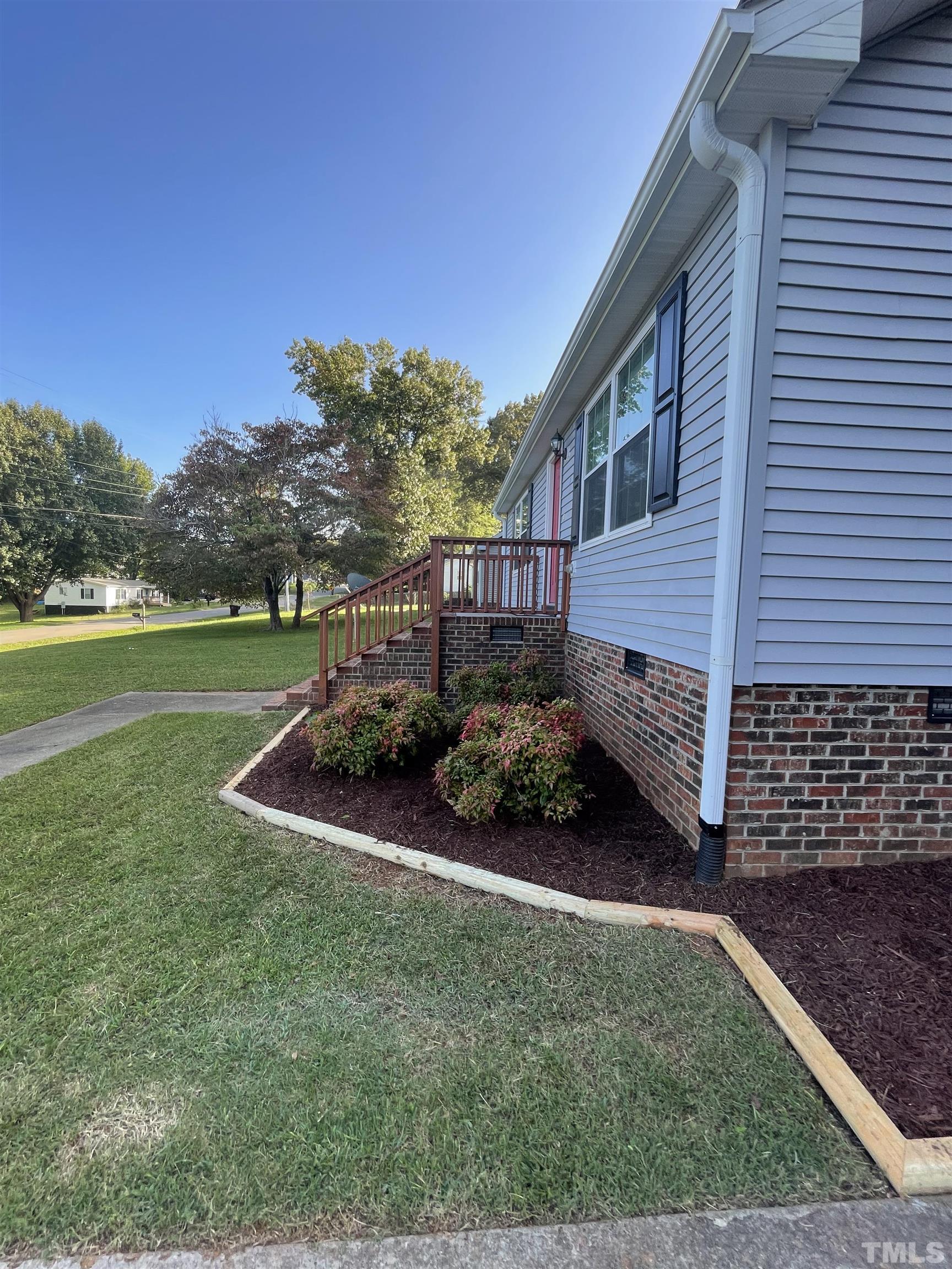 1323 Pointer Street Roxboro, NC 27573 - Photo 50 of 51 a view of a house with backyard and garden