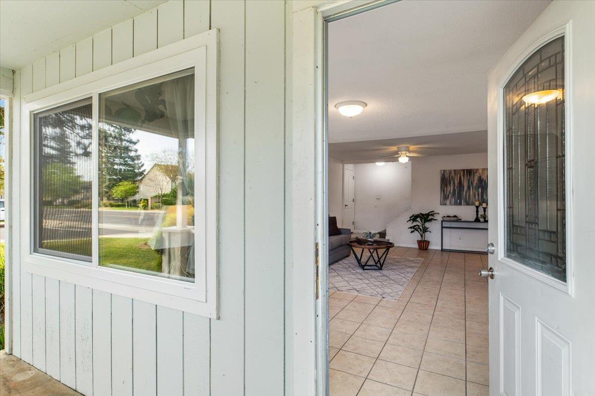 572 Pedersen Road Oakdale, CA 95361 - Photo 7 of 36 a view of a hallway with dining room and furniture