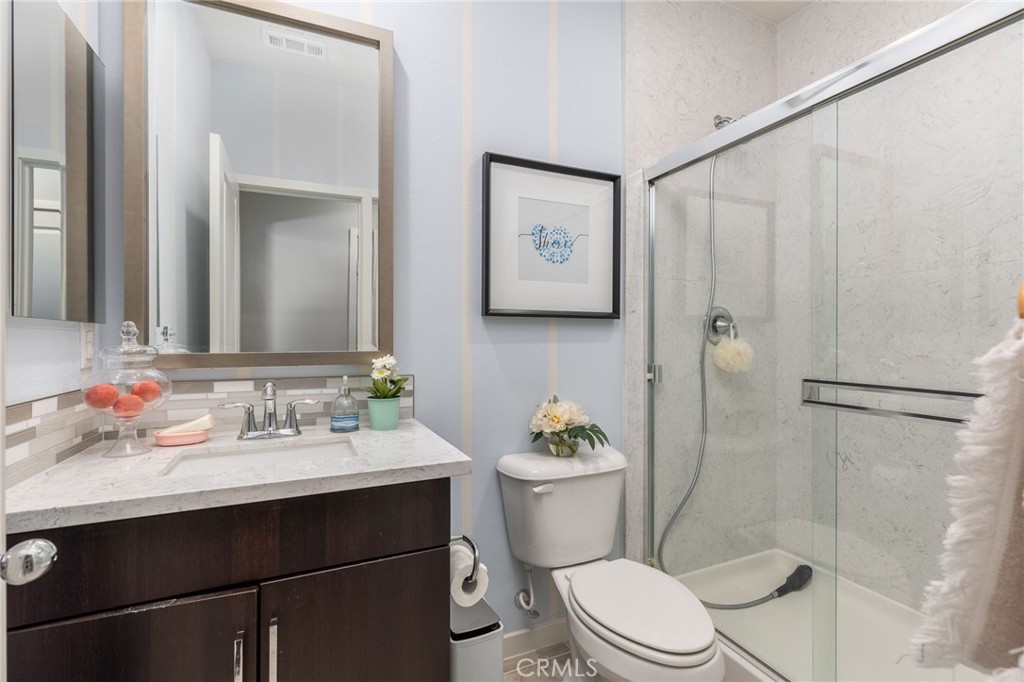 31094 Branches Circle Winchester, CA 92596 - Photo 18 of 32 a bathroom with a sink vanity mirror and toilet