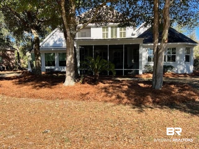 404 Peninsula Boulevard Gulf Shores, AL 36542 - Photo 39 of 51 Back of house with a sunroom