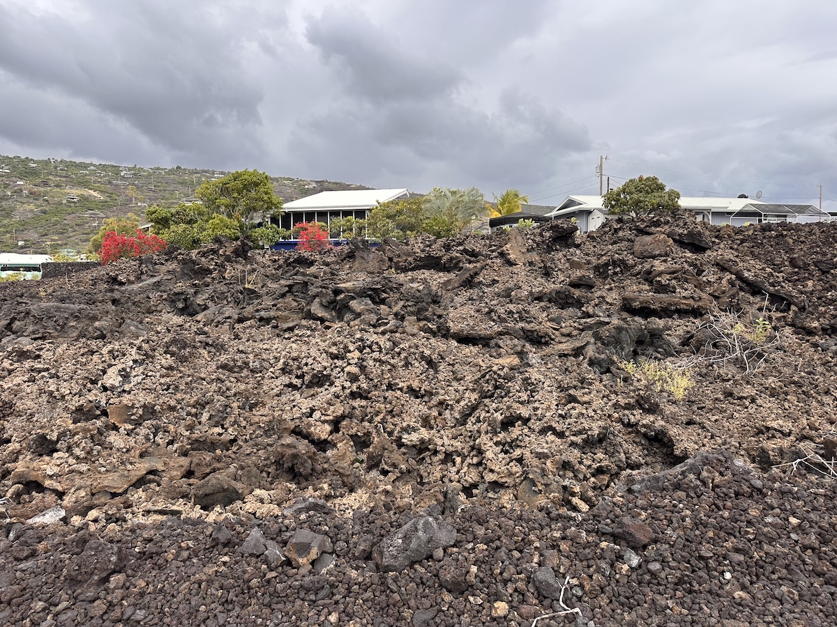 8 Akahi Avenue Captain Cook, HI 96704 - Photo 2 of 10 a view of a lake with a building in the background