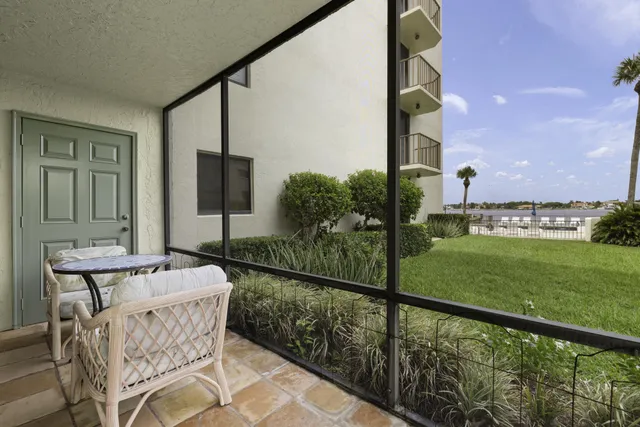a view of balcony with furniture