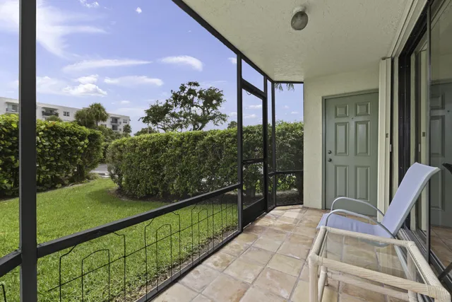a balcony with trees in front of it
