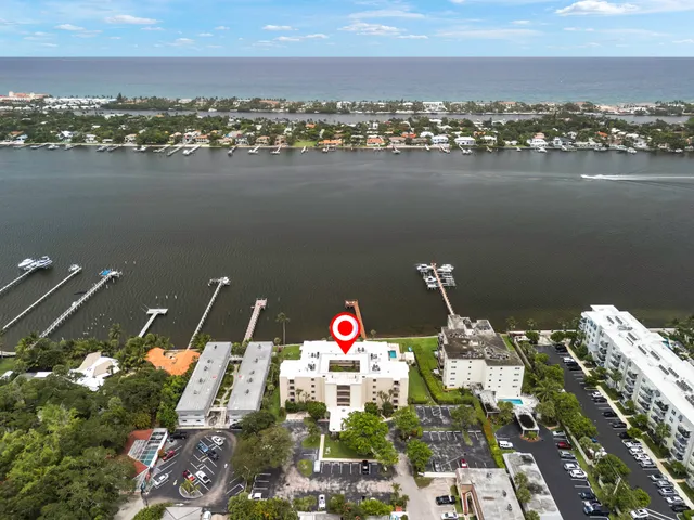 a outdoor space with lots of trees houses and lake view