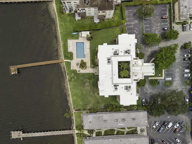 an aerial view of a house with outdoor space