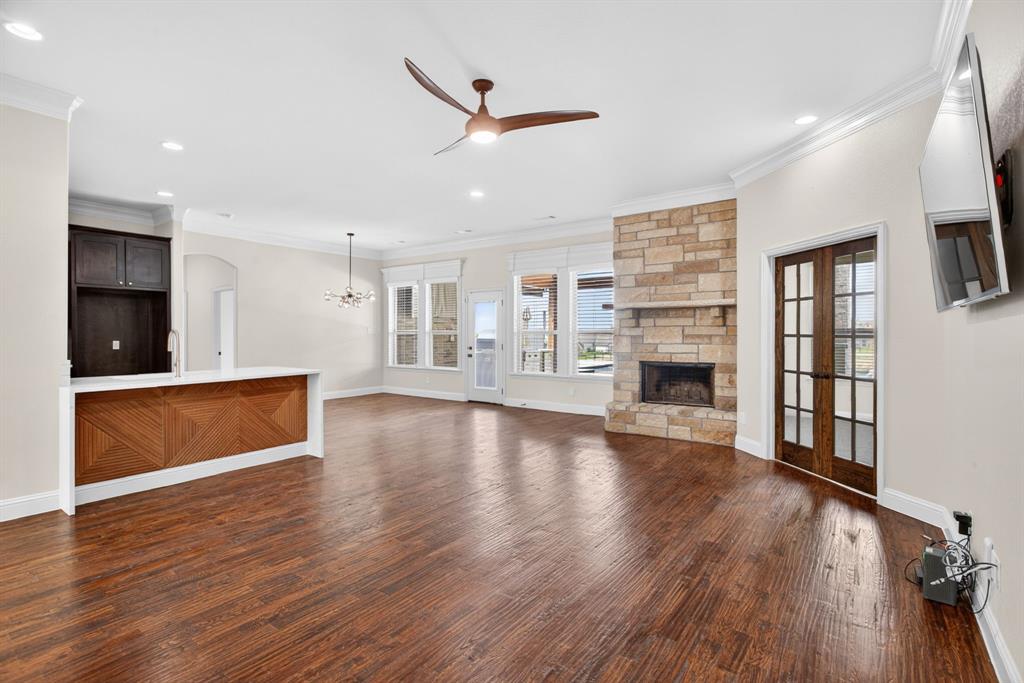 7320 Spring Ranch Court Godley, TX 76044 - Photo 9 of 38 a view of an empty room with wooden floor and a window