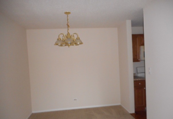 1117 South Old Wilke Road, Unit 106 Rolling Meadows, IL 60005 - Photo 6 of 13 a view of a chandelier fan in kitchen