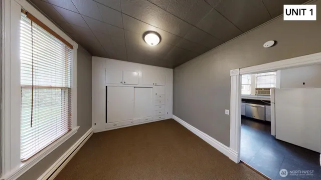 a bathroom with a shower and toilet