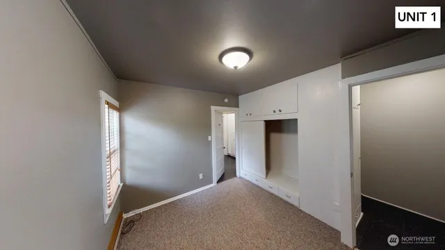 a view of an empty room with a window