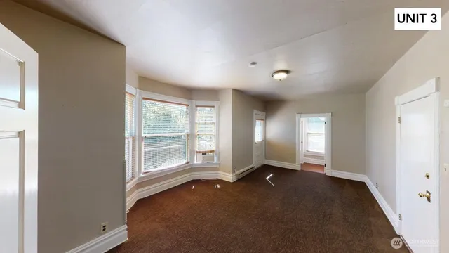 a kitchen with sink cabinets and wooden floor