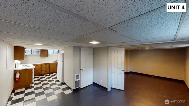 a picture of a bench in front of a wall