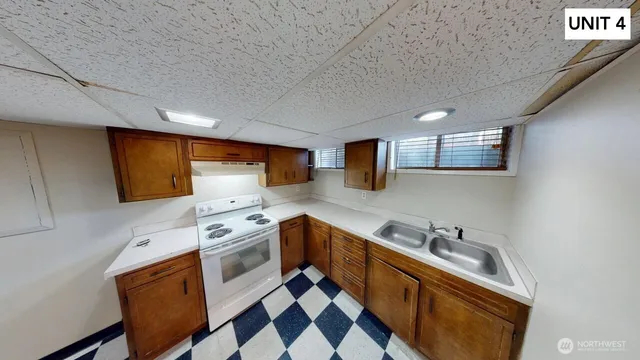 a view of a storage & utility room with a sink