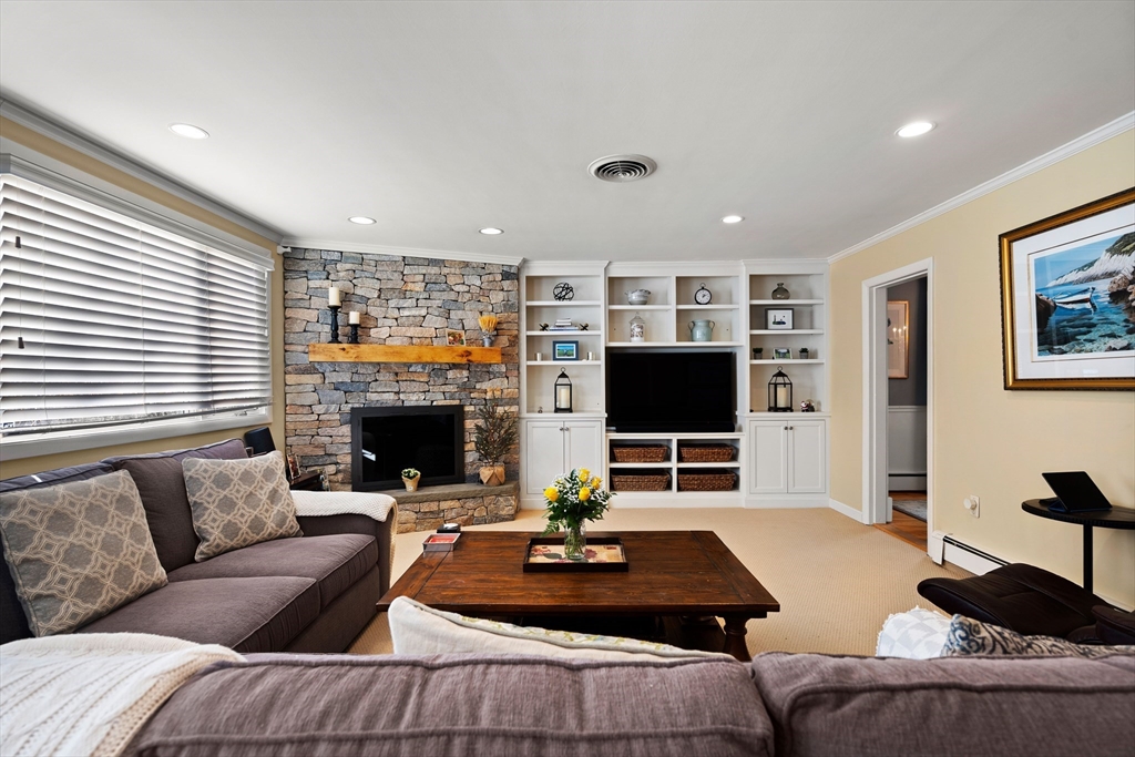 4 Dean Road Marblehead, MA 01945 - Photo 14 of 38 a living room with furniture a flat screen tv and a fireplace