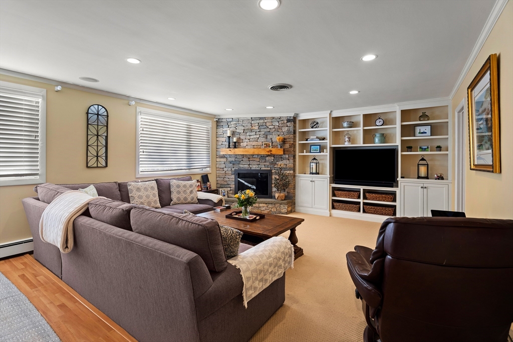 4 Dean Road Marblehead, MA 01945 - Photo 16 of 38 a living room with furniture a flat screen tv and a window