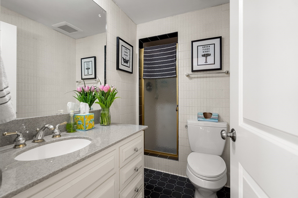 4 Dean Road Marblehead, MA 01945 - Photo 17 of 38 a bathroom with a granite countertop toilet sink and a mirror