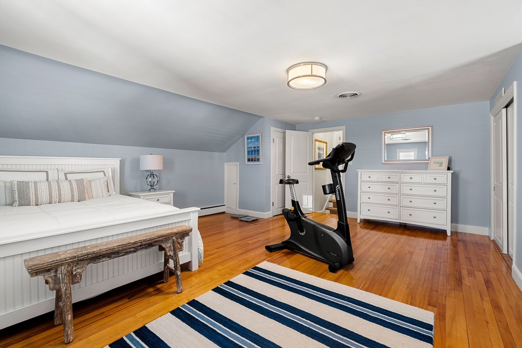 4 Dean Road Marblehead, MA 01945 - Photo 19 of 38 a room with gym equipment and wooden floor