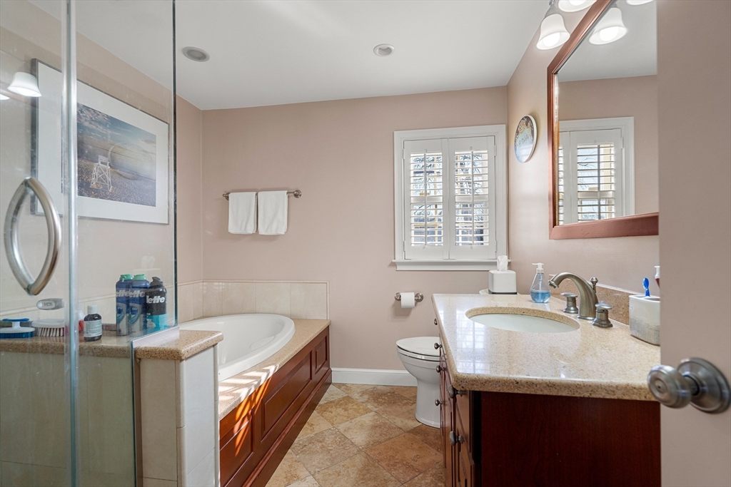 4 Dean Road Marblehead, MA 01945 - Photo 21 of 38 a bathroom with a granite countertop sink and a bathtub