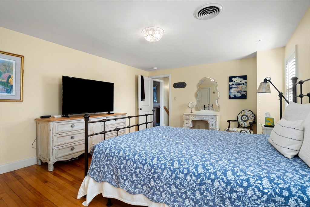 4 Dean Road Marblehead, MA 01945 - Photo 23 of 38 a bedroom with a bed and a flat screen tv
