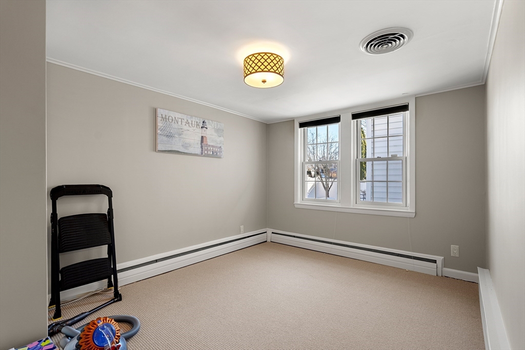 4 Dean Road Marblehead, MA 01945 - Photo 27 of 38 an empty room with windows and fan