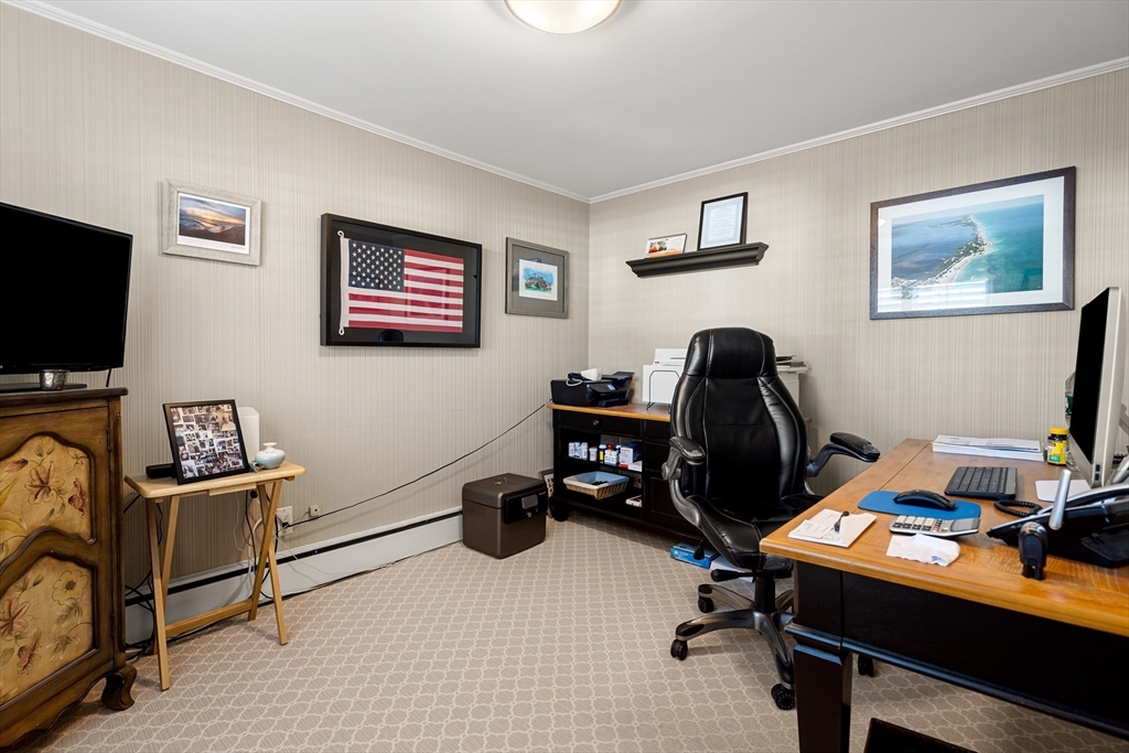 4 Dean Road Marblehead, MA 01945 - Photo 28 of 38 a view of a workspace with furniture and a flat screen tv