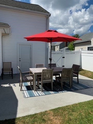 4 Dean Road Marblehead, MA 01945 - Photo 32 of 38 a patio with tables and chairs