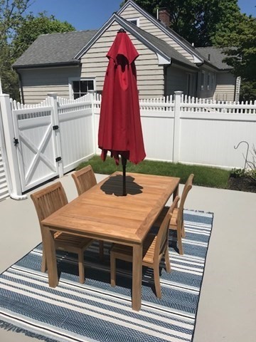 4 Dean Road Marblehead, MA 01945 - Photo 33 of 38 a view of a patio with table and chairs with the umbrella