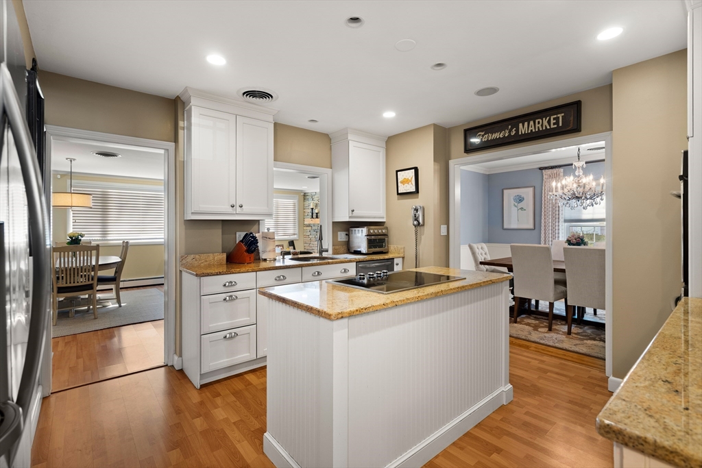 4 Dean Road Marblehead, MA 01945 - Photo 8 of 38 a kitchen with white cabinets and appliances
