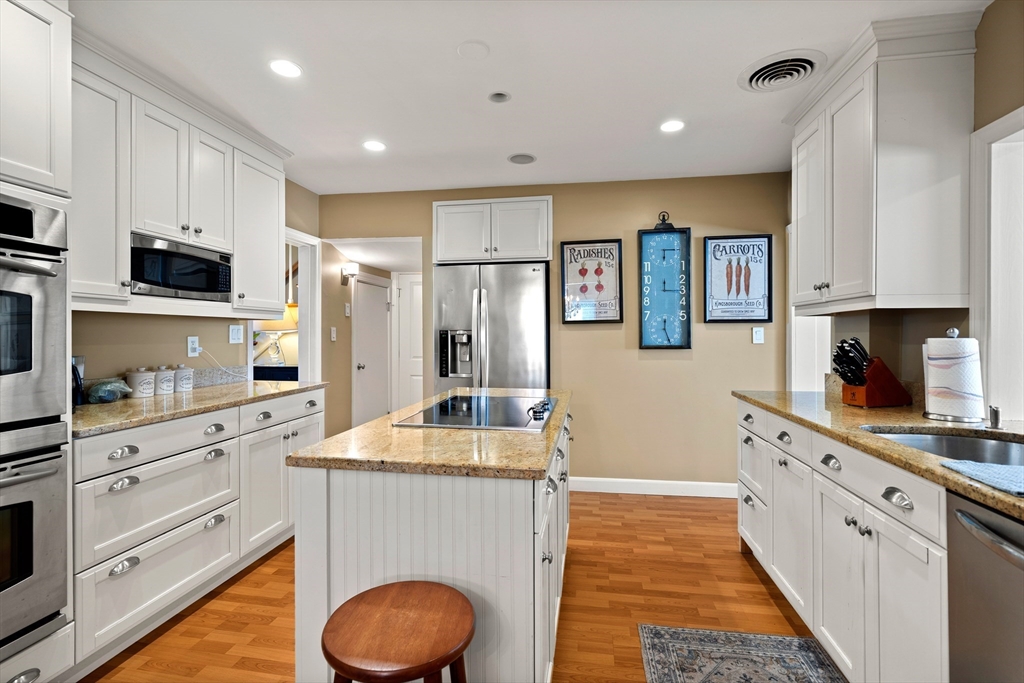 4 Dean Road Marblehead, MA 01945 - Photo 10 of 38 a kitchen with granite countertop a sink stove and refrigerator