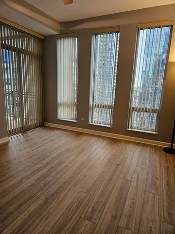 wooden floor and windows in an empty room
