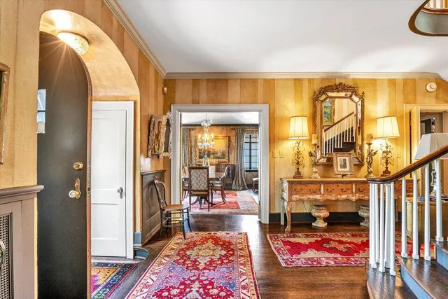a living room with furniture and large windows