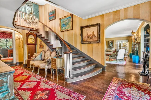 a bathroom with a sink and mirror with bathtub
