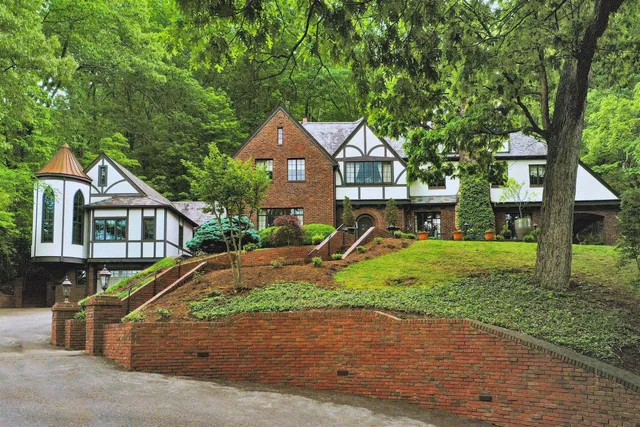 a view of a patio with table and chairs and potted plants