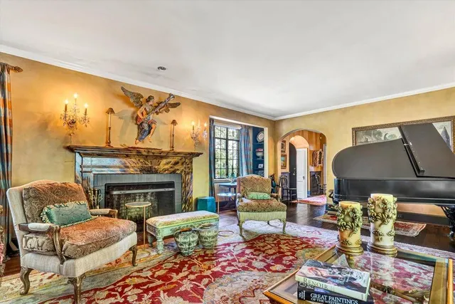 a kitchen with stainless steel appliances granite countertop a stove and a dining table next to a window