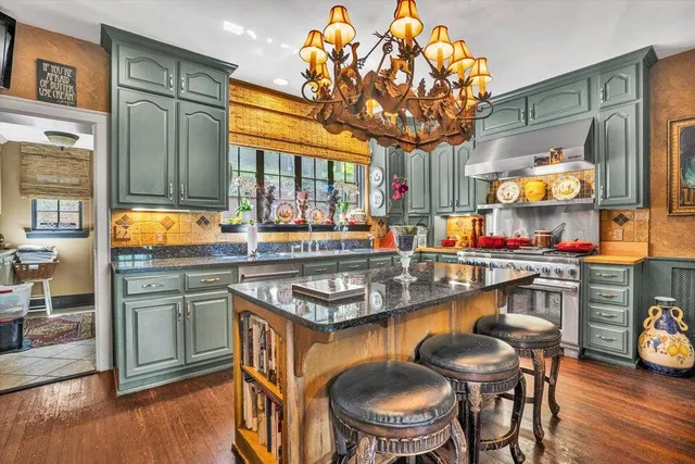 a bathroom with a sink a mirror and shower