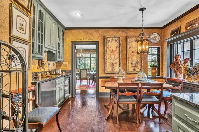 a view of entryway with wooden floor and a front door