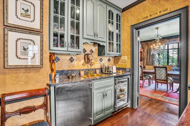 a living room with furniture and a book shelf