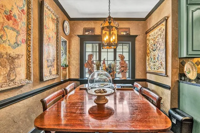 a living room with furniture and a book shelf
