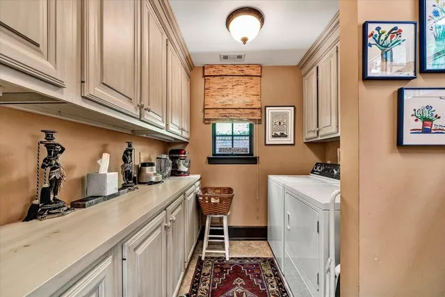 a bathroom with a granite countertop sink a mirror and a vanity
