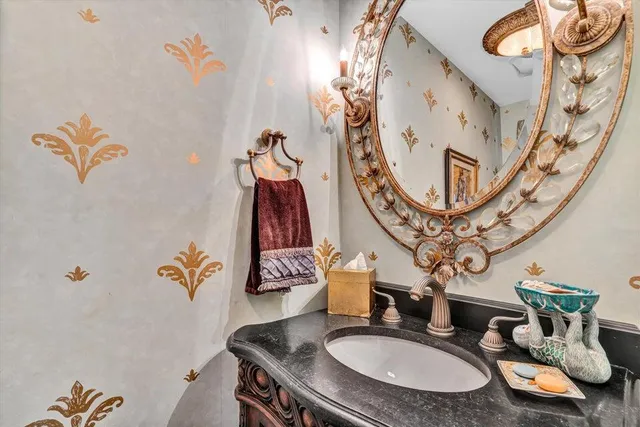 a living room with furniture a flat screen tv and a table